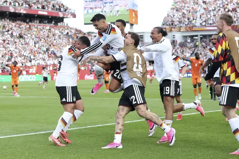 Germany players celebrating Undav’s late goal