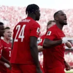 canada-players-celebrate-historic-world-cup-point