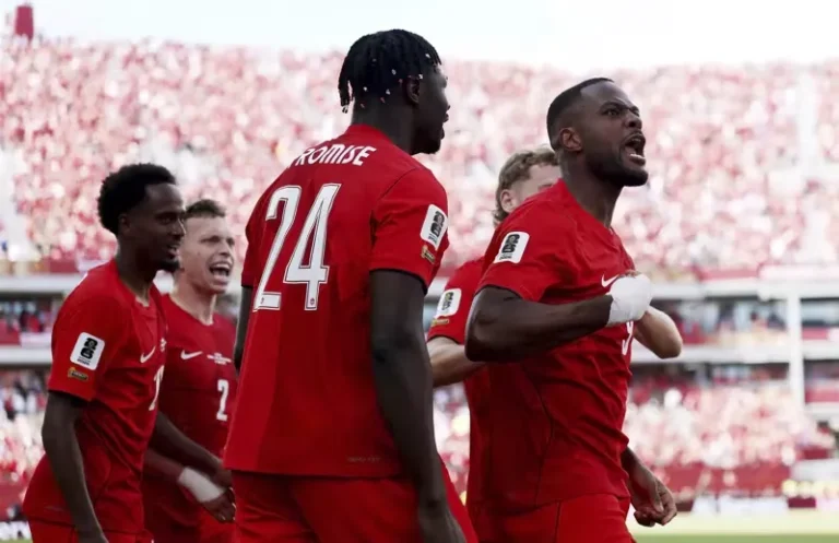canada-players-celebrate-historic-world-cup-point