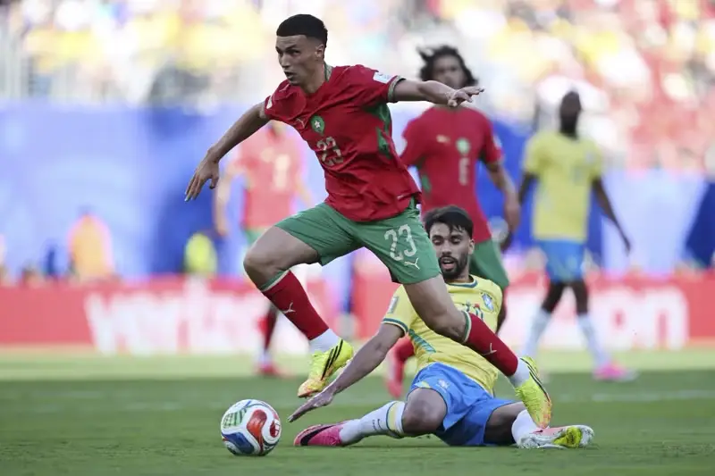 Morocco player driving forward under pressure against Brazil in the World Cup 2026 draw