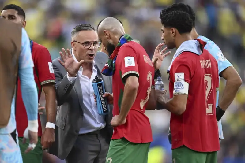 Morocco coach giving instructions to players during the Brazil vs Morocco World Cup 2026 match